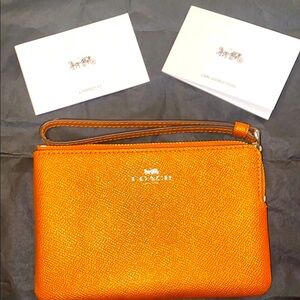 Coach Orange Wristlet NWOT 🏷 (Care instructions)